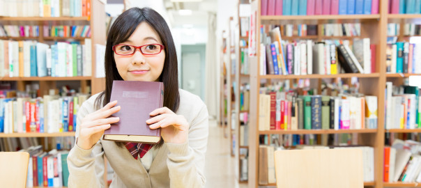 young asian student in the library