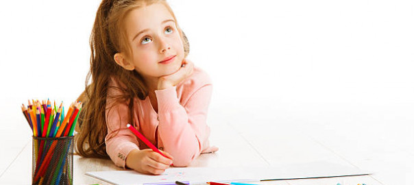 Child Education Concept, Kid Girl Drawing and Dreaming School, Lying down on White Background